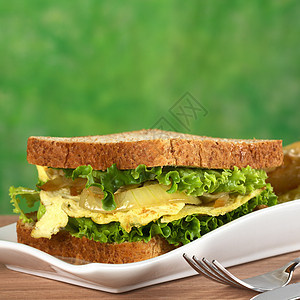 炒蛋三明治照片小吃蔬菜洋葱早餐黄色面包油炸食物午餐图片