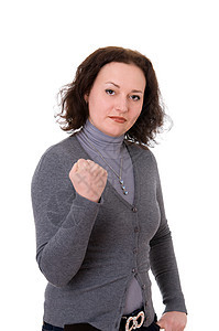 穿着灰色大衣的女人手势头发拳头成人白色黑发女性牛仔裤手指女孩图片
