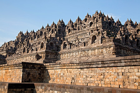 印度尼西亚博罗布杜尔寺庙装饰品神话佛塔蓝色吸引力天空佛教徒宗教建筑学纪念碑图片