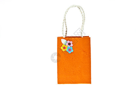 在白色背景上隔离的橙莓纸袋商品礼物材料橙子零售蓝色粉色纸袋生态叶子图片