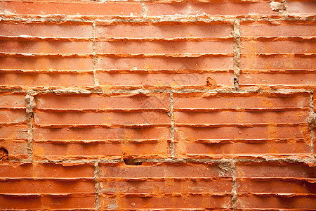 修复墙壁的砖墙中的破碎砖砖维修石头乡村衰变石膏建筑橙子砂浆水泥接缝图片