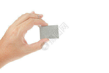 手持银键标签戒指安全钥匙白色阴影小路圆形笔记金属塑料图片