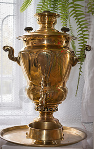 传统的俄罗斯古老圣山厨房文化茶炊古董用具纪念品艺术黄铜宏观反射图片
