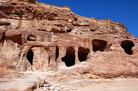 约旦佩特拉洞穴世界文化宗教山沟天空考古学地标建筑学砂岩图片