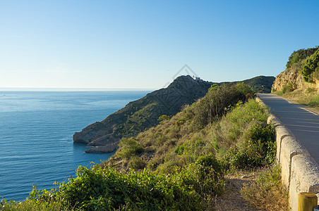 风景道路岩石水平海洋阳光晴天海岸图片