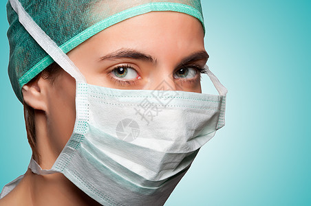 戴面罩的女性外科医生帮助手术职业专注操作房间疾病治愈女士医疗图片
