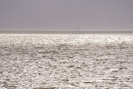 暴风暴洪水海岸灯光波浪地平线冲浪断路器暴风雨天气海浪风暴潮图片