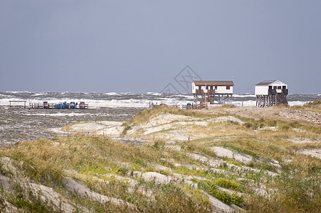 暴风暴洪水地平线沙丘冲浪断路器糕点海岸海浪泥滩高跷天气图片