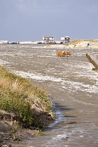 暴风暴洪水建筑糕点断路器沙丘天气风暴潮海岸波浪灯光高跷图片
