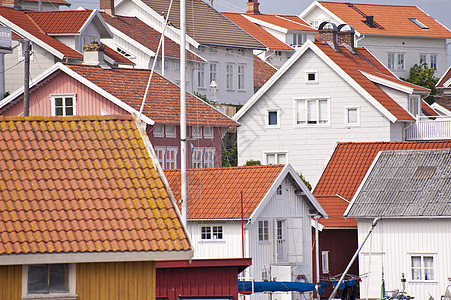 瑞典的Gullholmen框架田园诗黄色岛屿天空建筑物渔村红色海岸蓝色图片