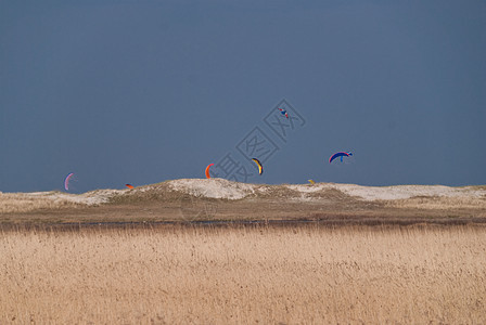 风筝地平线沙丘天空海滩海岸季节图片