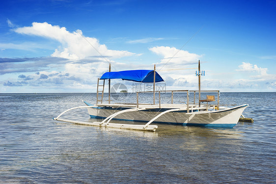 传统的菲律宾船阳光情调假期血管码头海滩木头异国钓鱼渔民图片