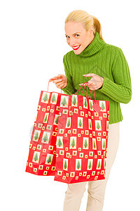 带着带圣诞礼物袋的女人购物金发女士成人头发购物袋礼物女子微笑金发女郎图片