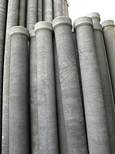 隔离的石棉管道贮存制造业工业建筑灌溉灰色水泥下水道圆柱仓库图片