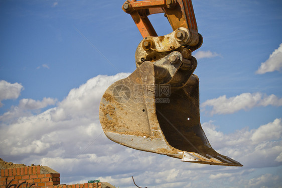 云天的挖掘机矿业力量反铲装载机建造活动蓝色车辆土壤刀刃图片
