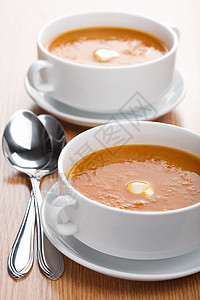 奶油蔬菜汤饮食午餐美食橙子草本植物盘子餐厅勺子液体用餐图片