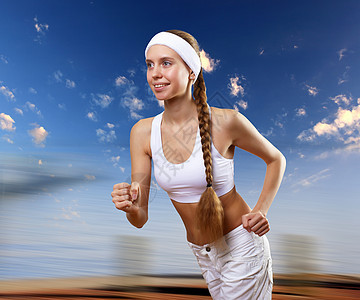 一名年轻女子运动的肖像活力运动装跑步体操慢跑火车快乐女士蓝色青年图片
