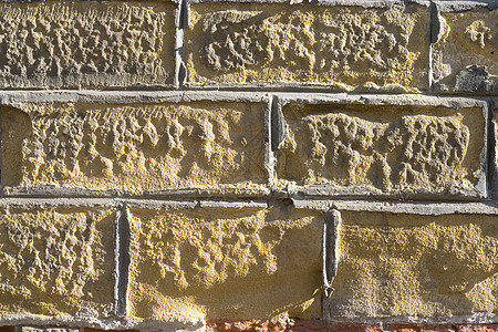 旧砖墙斑点砖块石方黄色水泥石匠石头橙子护岸风化图片
