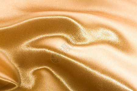 金色缎面涟漪黄色纺织品布料丝绸材料折痕织物曲线奢华图片
