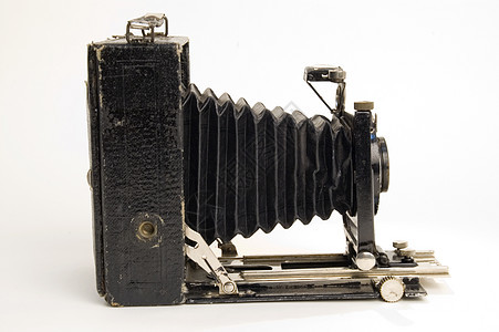 旧古典摄影机有毛皮机械摄影师收藏品相机光学电影皮革黑色照相机爱好图片