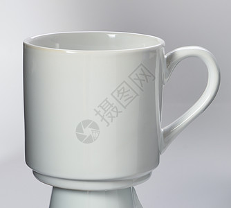 白色背景上孤立的茶杯咖啡杯餐具反射时间咖啡陶瓷阴影制品杯子图片