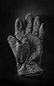 旧手套风化垃圾皮革黑色背景图片