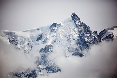 山上有高山冰川旅游旅行远足爬坡阳光活动太阳蓝色顶峰图片