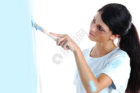 妇女在墙上涂油漆别针画家蓝色艺术成人房子设计师女孩男人快乐图片