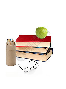 书本和绿苹果图片