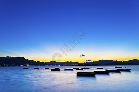 香港日落海岸假期海洋橙子海浪季节蓝色反射墙纸太阳支撑图片