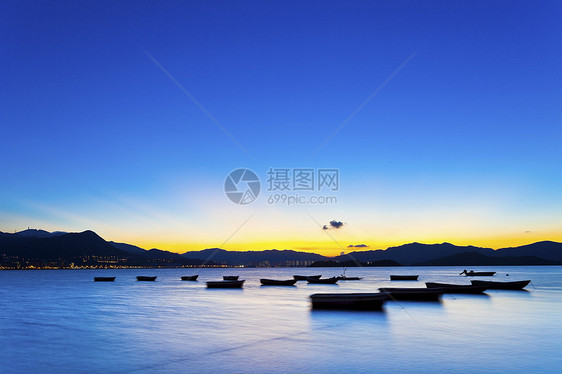 香港日落海岸假期海洋橙子海浪季节蓝色反射墙纸太阳支撑图片