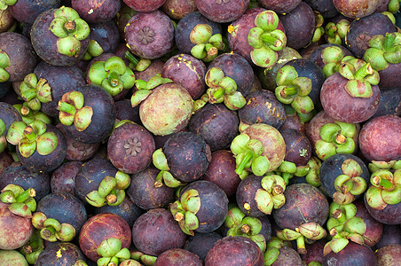 台风山竹芒果市场热带情调营养水果白色异国食物花园紫色背景