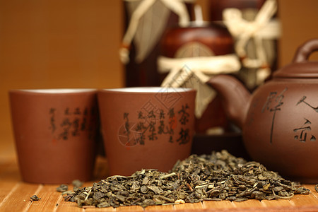 中国茶宏观陶器竹子液体传统食物金子杯子茶壶仪式图片