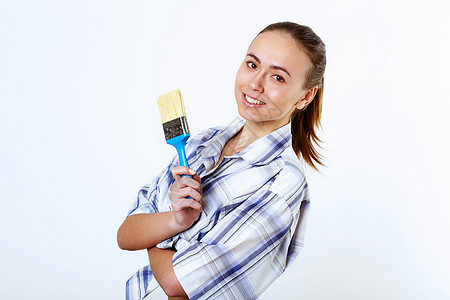 有油漆刷子的妇女中风房子画家夫妻男人妻子工具画笔艺术丈夫图片