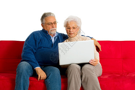 在沙发上用笔记本电脑的老夫妇拥抱工具男人按摩咨询家庭生活老年网络胡须夫妻图片