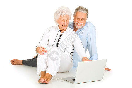 使用膝上型电脑的老年夫妇胡须夫妻互联网通讯咨询按摩成年人赤脚笔记本技术图片