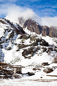 阿尔卑斯山的日落高山小木屋冻结天空季节高度冰川全景山脉旅行图片