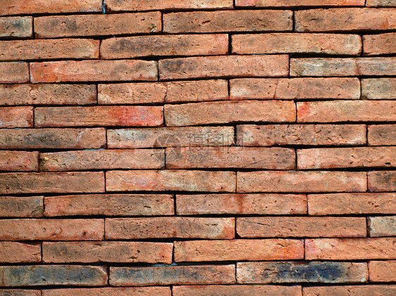 旧的红红色石板砖墙水泥装饰接缝宽屏黏土石工风化建筑石头墙纸图片