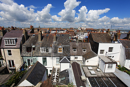 英格兰海滨小屋住房植物建筑蓝色屋顶建筑学房子天空旅行晴天图片