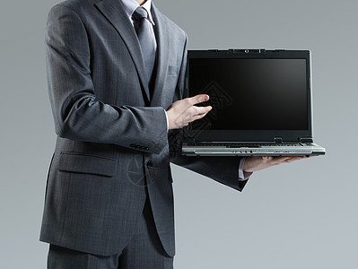 商务人士拿着笔记本电脑男性人类套装人士衬衫摄影商务衣服商业男士图片
