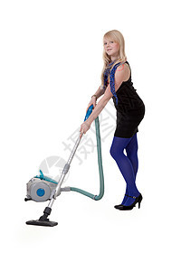 穿着蓝色紧身裤的女孩和吸尘器清洁工图片