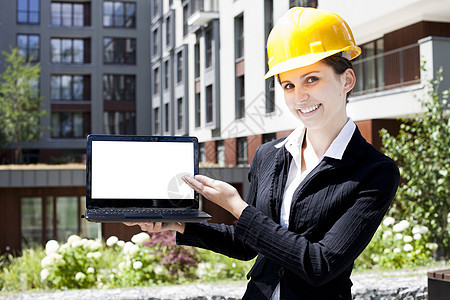 女建筑工工程师展示建设者建筑学头盔商务经理工程商业工人笔记本图片