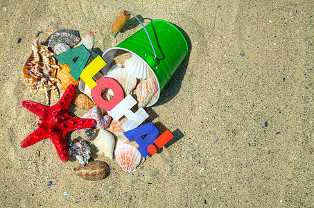 在沙滩上写着阿罗哈问候语阳光游客假期海星文化海滩旅行热带字母图片