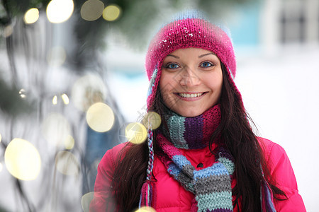 妇女及bokeh人耀斑背景魅力成人毛皮街道套衫雪花照明薄片图片