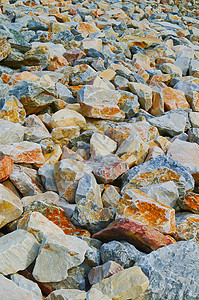 具有背景的岩石灰色白色建筑工作室收藏石头圆形矿物材料花岗岩图片