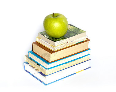 书本和苹果生产白色学校生活教育水果图书绿色背景图片