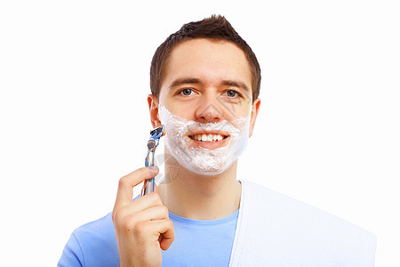 家里的年轻人刮胡子肩膀刀刃刮胡子微笑剃须膏卫生浴室护理身体泡沫图片