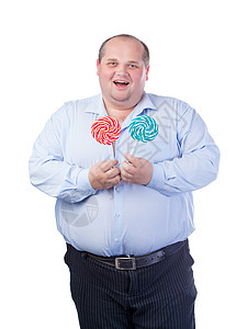 穿蓝衬衫的胖子 吃棒棒糖贪婪男人成年人白色工作室衬衫男性蓝色冒充肥肠图片