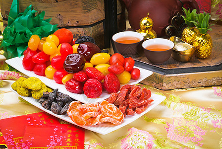 中国新年的干枯果实团体蔬菜橙子红色木瓜黄色黑色食物绿色花园图片