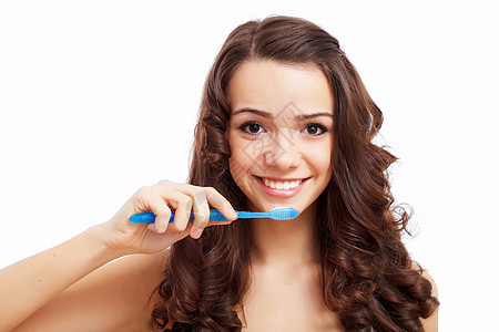在家刷牙的年轻妇女头发牙科金发刷子蓝色牙膏幸福女性牙齿卫生图片